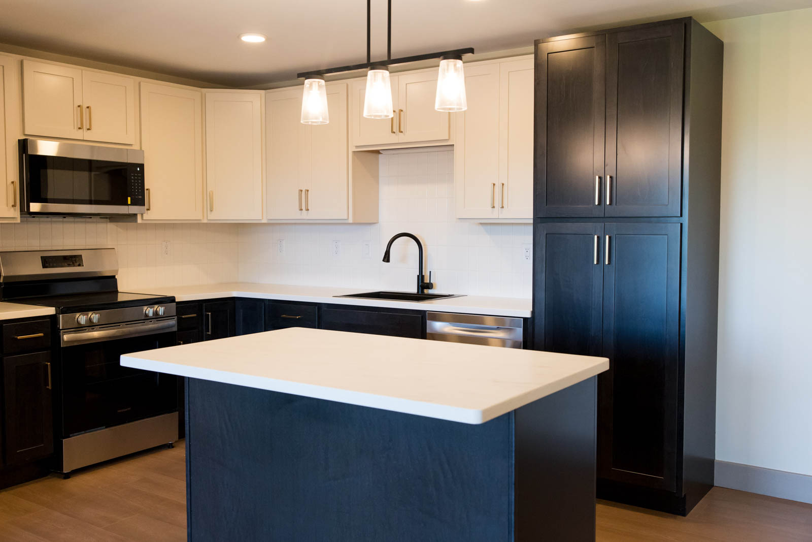 Kitchen at Brook Hill with island and stainless appliances